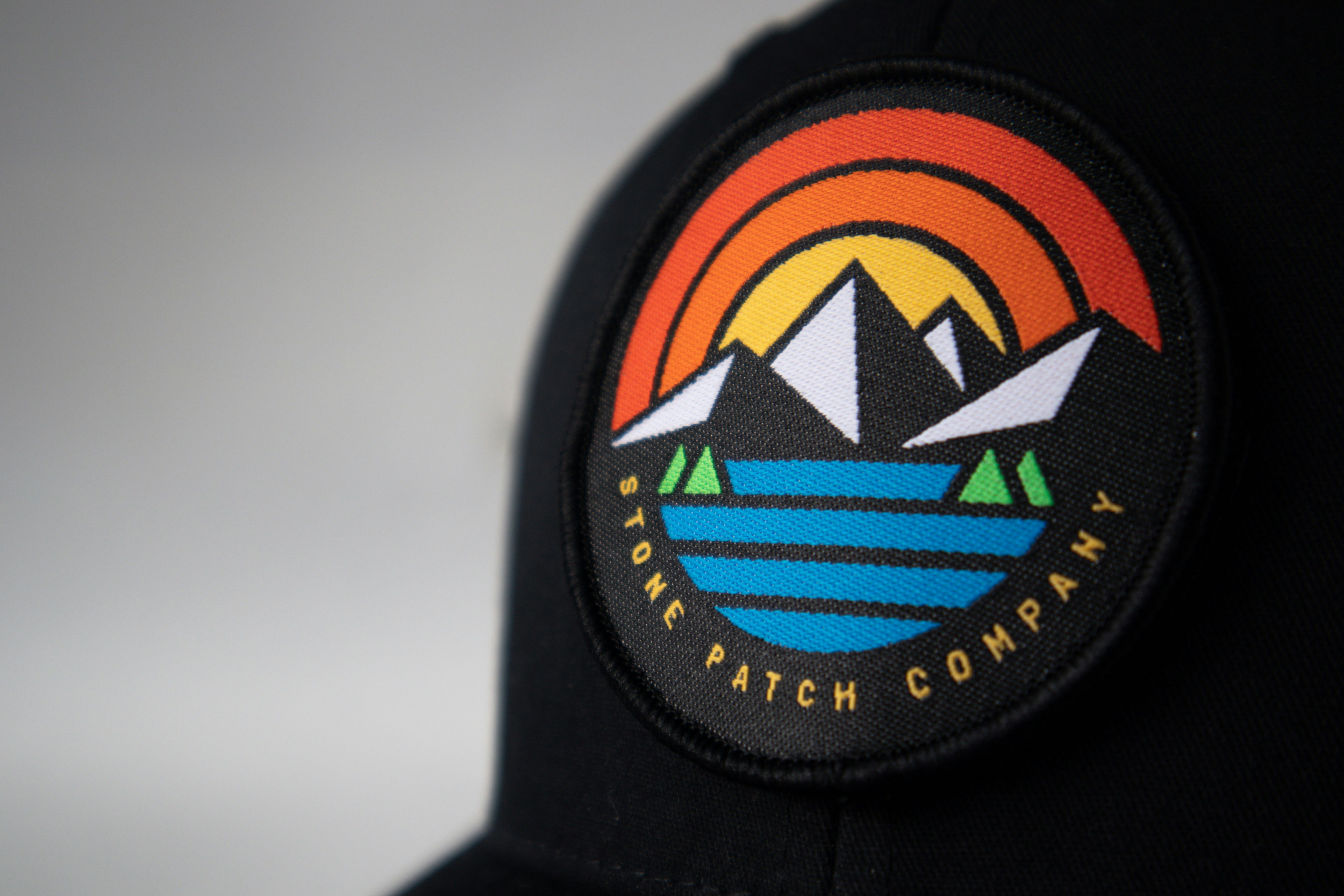 black orange and blue fitted cap